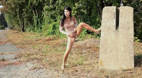 Dark haired girl Lady Dee wanders off the side off a road to take a pee 10586237