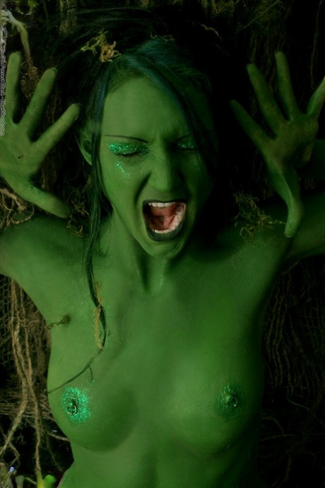 Solo girl with green skin wanders around the woods with no clothes on 69028544