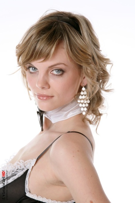 Sexy maid with striking eyes peels off her uniform to pose nude in stockings 54591600