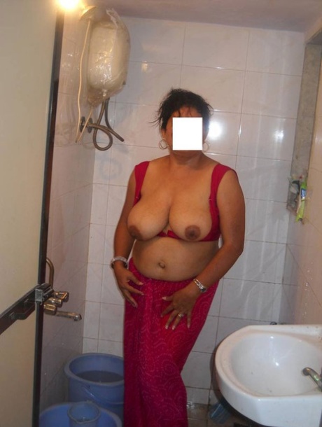 Busty Indian woman joins her man friend for foreplay on bed 18058116