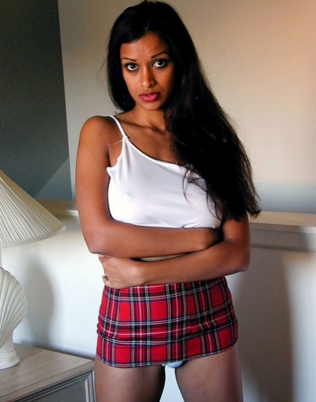 Pretty Indian girl exposes her round boobs and cotton panties on a bed 94761433