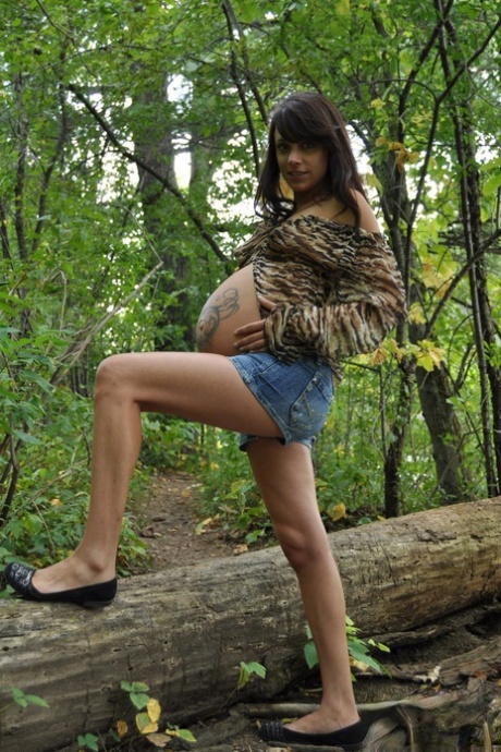 Pregnant amateur Brianna shows tits and twat plus swollen belly in the woods 95030928