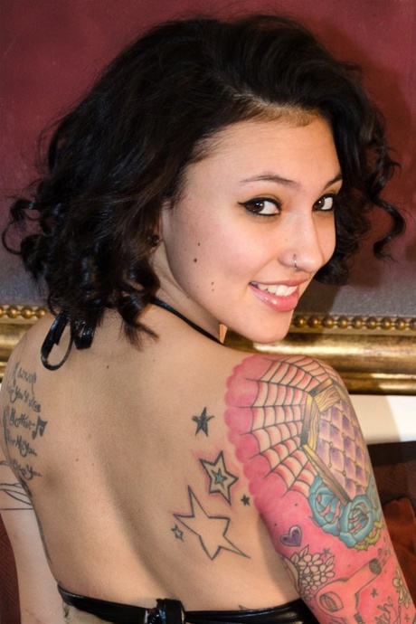 Tattooed brunette teen Reyna removes a latex bikini to go nude 53938207