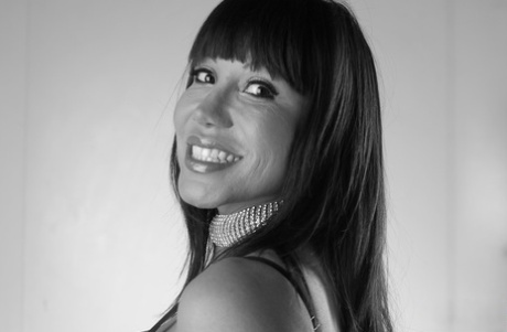 Asian woman Ava Devine pours alcohol on her huge breasts in solo action 87561596