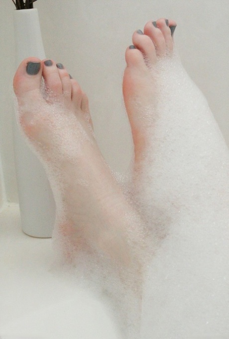 Pale redhead Lucy OHara lathering up her sweet perky tits & toes in the shower 33418535