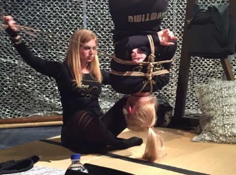 Blonde female finds herself hanging upside down by ropes after meeting a woman 94622037