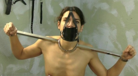Caucasian sex slave has her nipples clamped while restrained in a dungeon 38689565