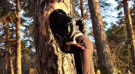 Sexy girl Katy Dee leans back against a tree to take a badly needed pee 72153057