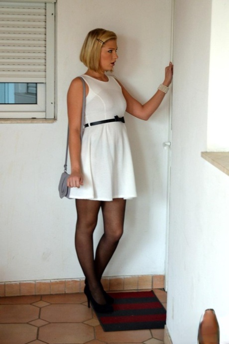 Blonde teen in black nylons and garters shows an older man her nude body 61418720