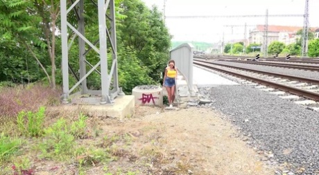Nice girl Ali Star takes a badly needed piss not too far from railway tracks 27589200