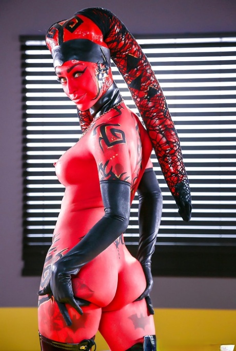 Cosplay model Kleio Valentien exhibiting pink pussy in long latex boots 46212561
